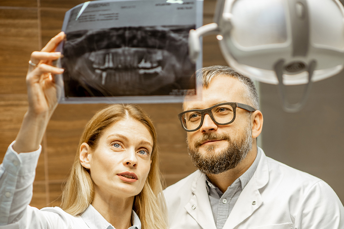 Prevention is better than cure. Shot of a young doctor examining Prevention is better than cure. Shot of a young doctor examining an x-ray in an office