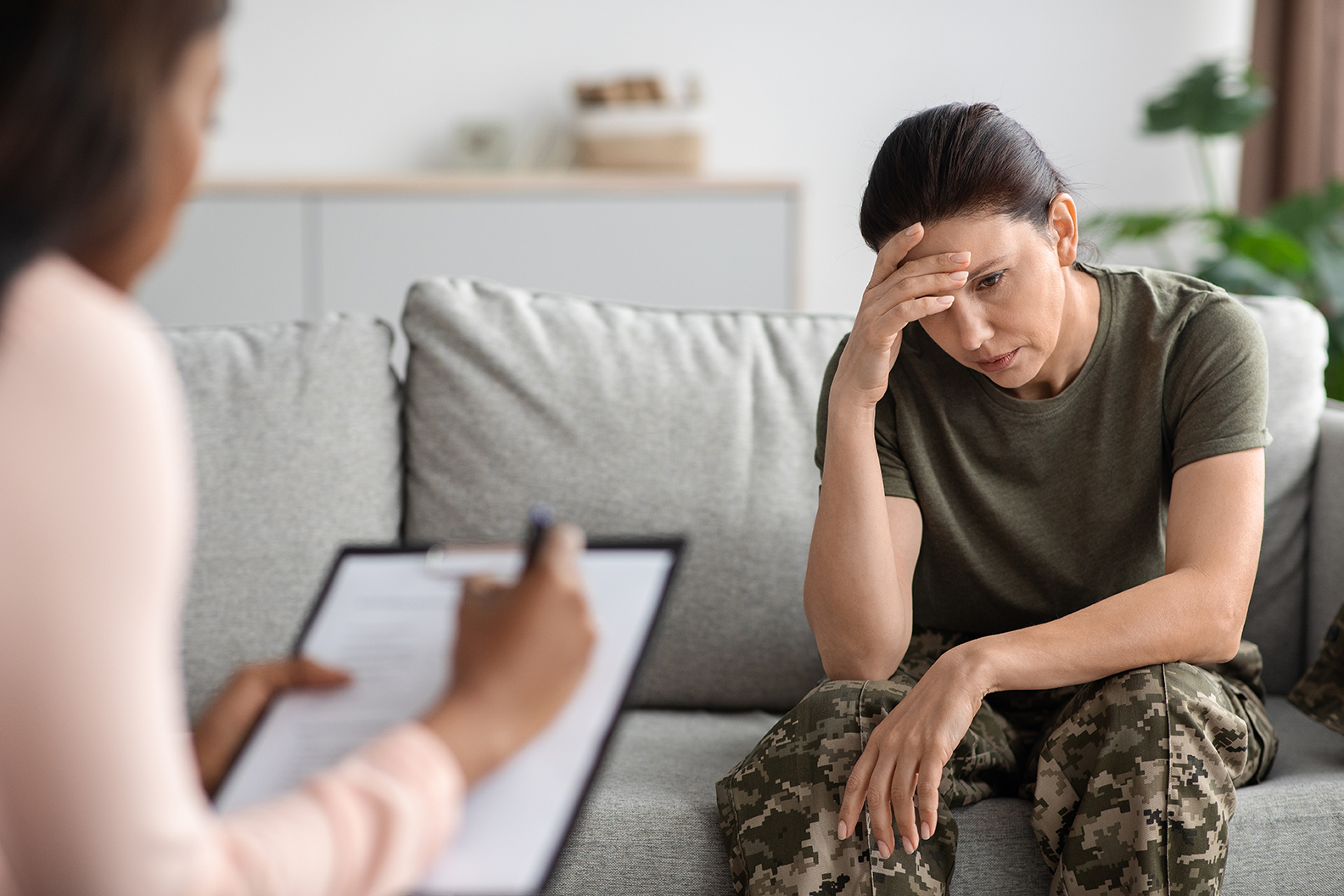 Military psychiatry concept. Depressed soldier lady sitting on couch during therapy session Sleep disorder sleep disorders Sleep aid cant sleep help fallin asleep insomnia help with sleep Sleep difficulties sleep issues sleep medication medication for sleep