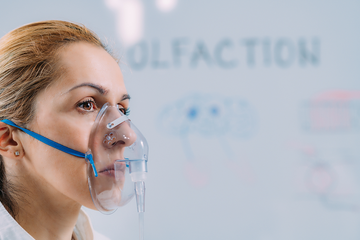 Olfaction. Female Scientist Examining Smells with Mask. Pulmonary pulmonary function testing breathing lungs