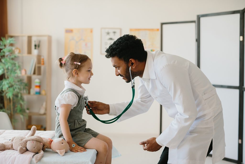 Child receiving a routine check-up before the start of the school year, ensuring they are healthy and prepared for cademic success