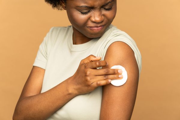 vaccinated-african-woman-showing-arm-with-cotton-p-2023-11-27-05-17-17-utc